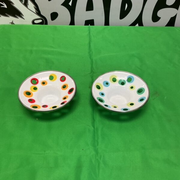 Colourful IKEA tea light holders with a polka dot pattern.
