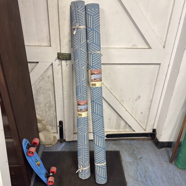 Pair of illusion outdoor rugs for garden or patio use.
