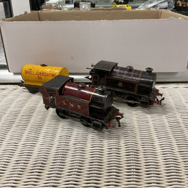 Two vintage O gauge clockwork Hornby engines shell tanker truck and quantity of track