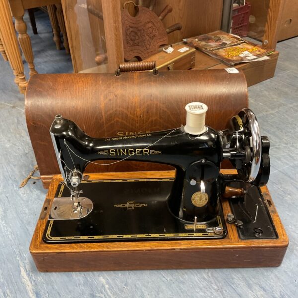 Vintage singer sewing machine in case with key