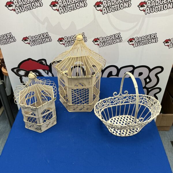 Two vintage metal bird cages with basket