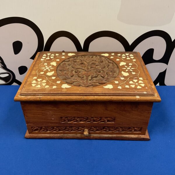 Front view of intricately carved Indian jewellery box.