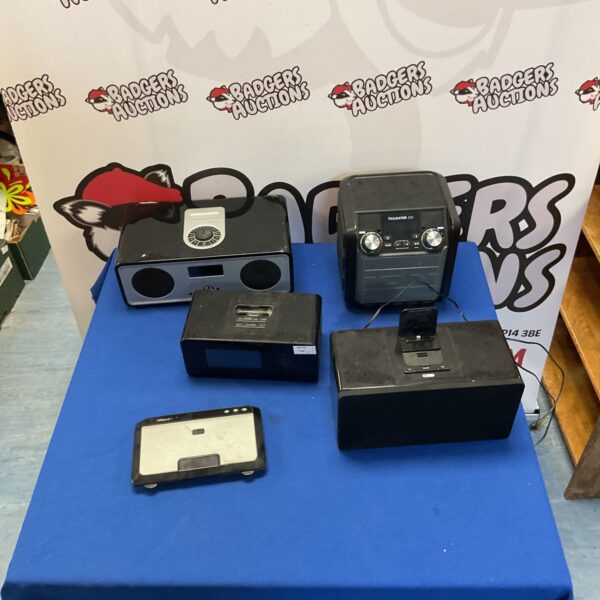 Vintage iPod docking station and portable speaker selection.
