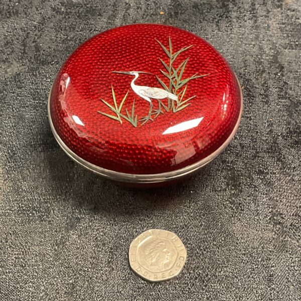Antique Japanese cloisonne trinket pot with red enamel and white crane.