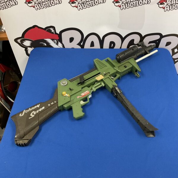 Vintage Johnny Seven OMA toy gun, green plastic machine gun.
