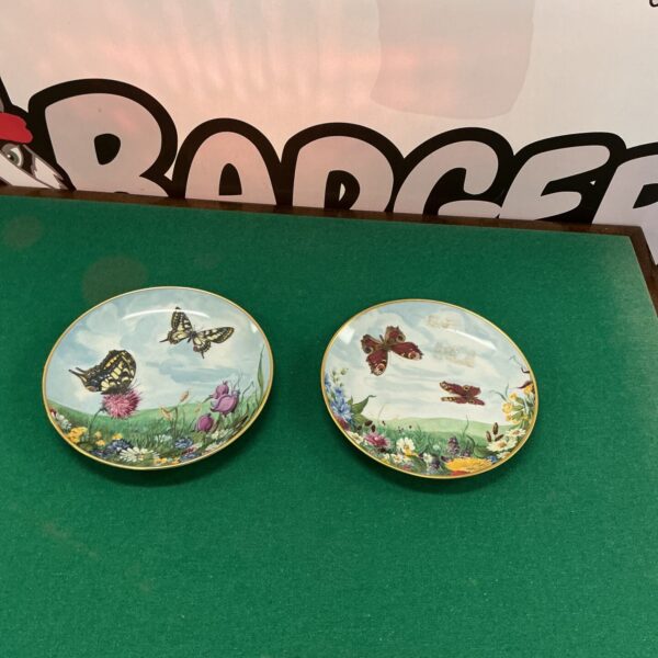 Kaiser pottery collector plate with butterfly and floral design.
