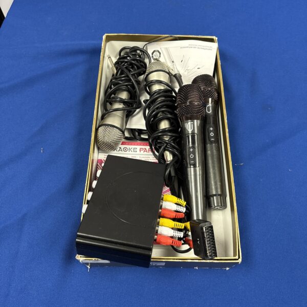 Assorted handheld karaoke microphones in a collection.