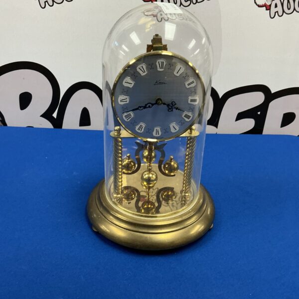 Vintage Kevin West German eight-day mantle clock with brass case.