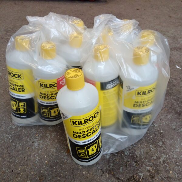 Twelve bottles of yellow Killrock descaler for limescale removal.
