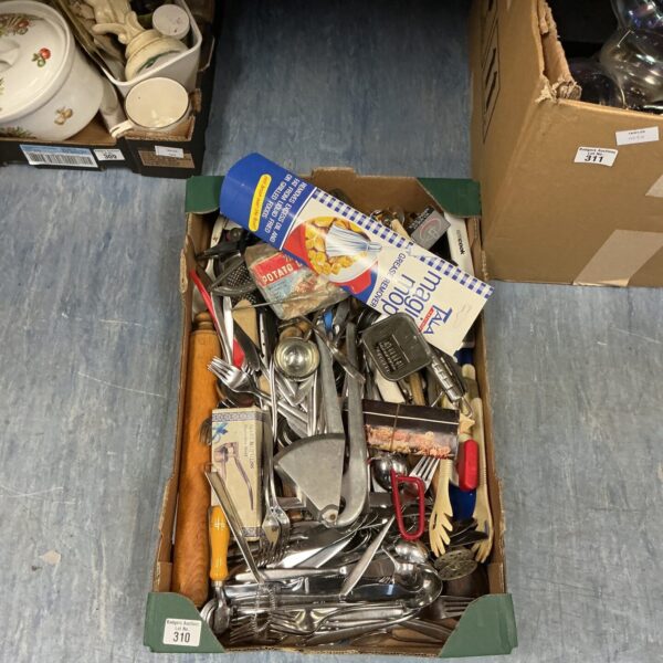 Mixed lot of kitchen utensils including a garlic press.