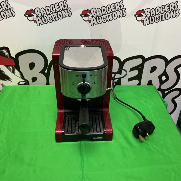 Front view of a silver Klarstein coffee machine on a dark surface.