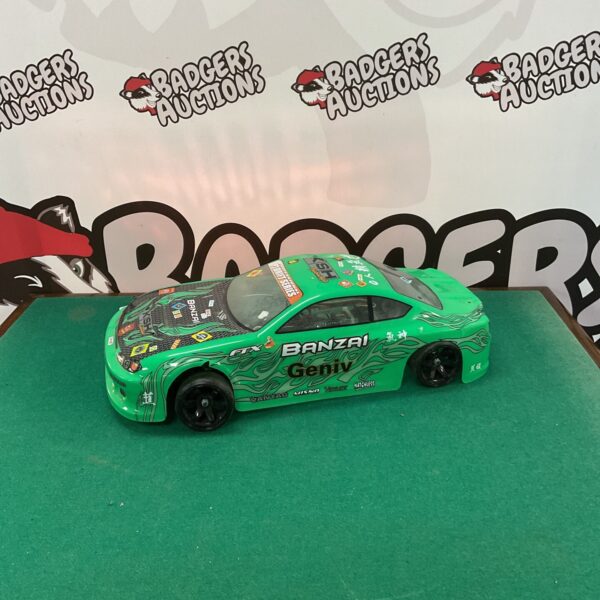 Green KSH Fastracked P1 RC drift car with sponsor decals.
