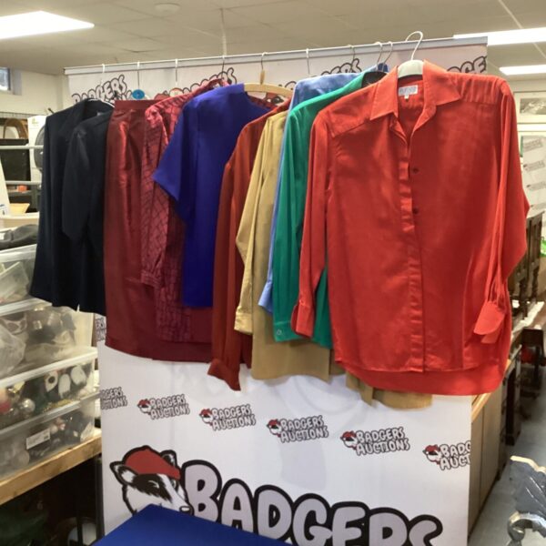 Mixed lot of ladies blouses and a skirt for sale.