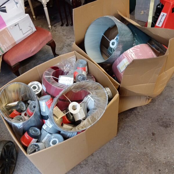 Two boxes of new pink goodhome lamp shades for home lighting.