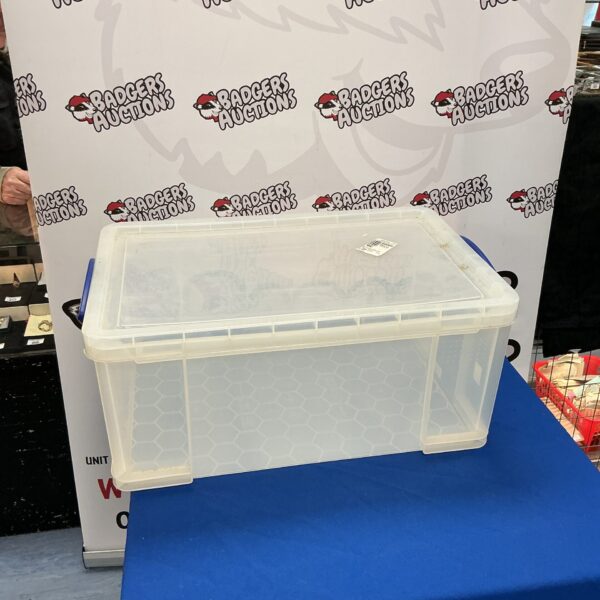 Large plastic storage box for household organisation and decluttering.
