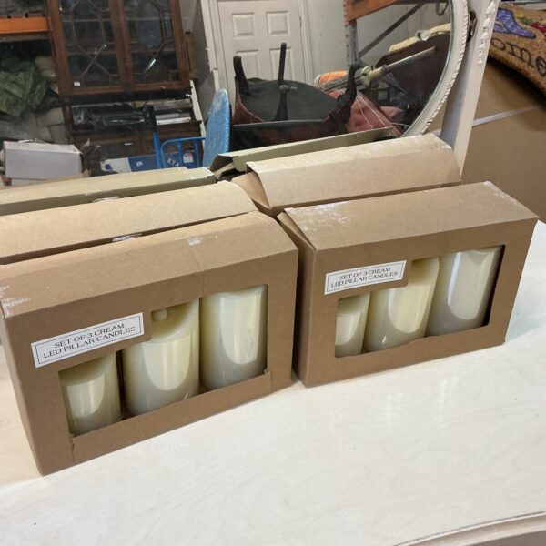 Four packs of LED candles for warm home lighting.