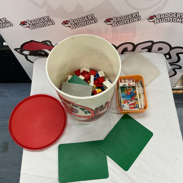 Large tub of mixed Lego bricks with vintage instructions included.