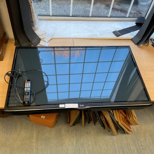 LG 50 inch plasma TV with remote control for home entertainment.