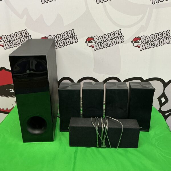 Black LG surround sound system with subwoofer and satellite speakers.
