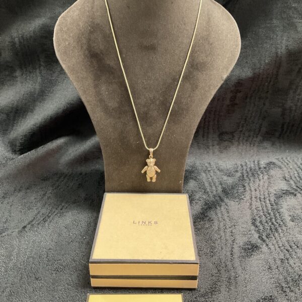 Silver Links of London teddy bear pendant on a chain.