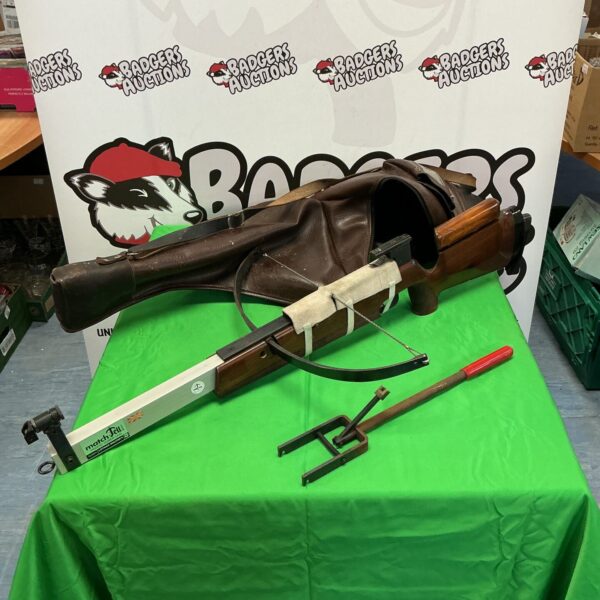 Vintage Lothar Walther Match Tell crossbow with leather case on green table.