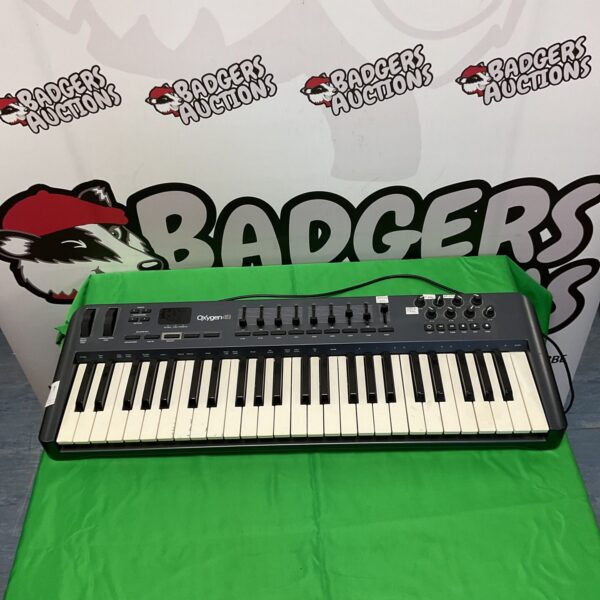 M-Audio Oxygen 49 keyboard controller for music production.