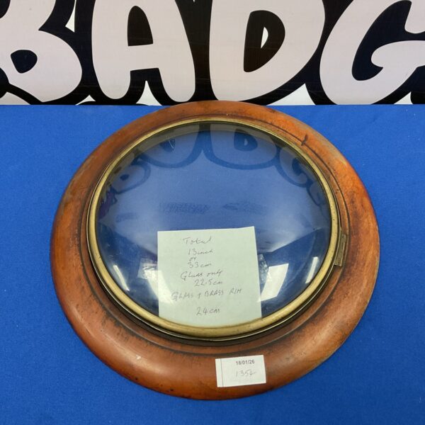 Antique mahogany porthole clock glass with brass frame.