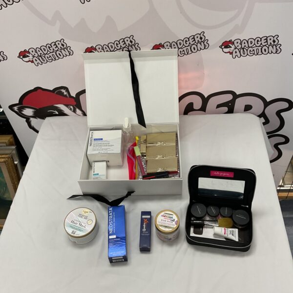 Makeup and beauty lot with hair masks and face cream.