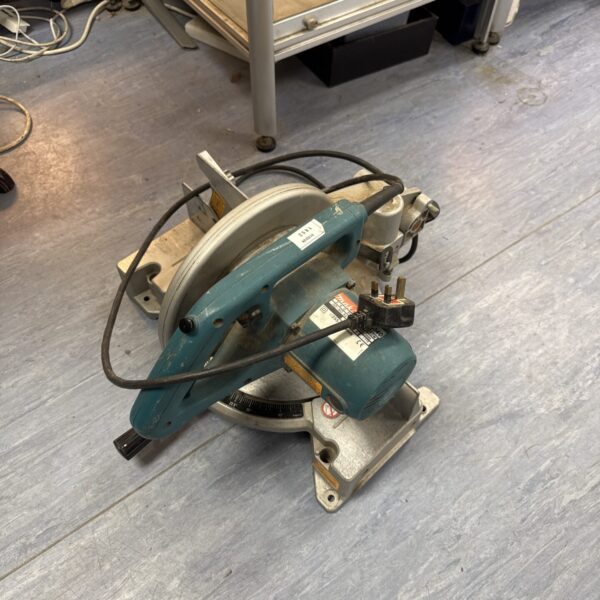 Makita LS1040 mitre saw, an electric power tool for woodworking projects.