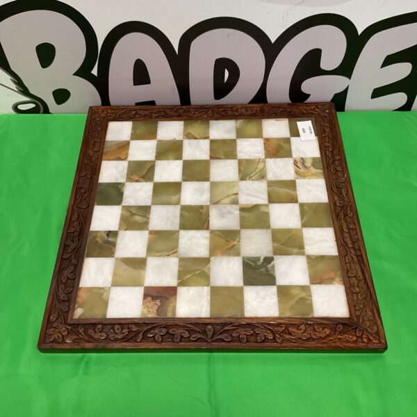 Vintage marble chess board with carved oak frame.