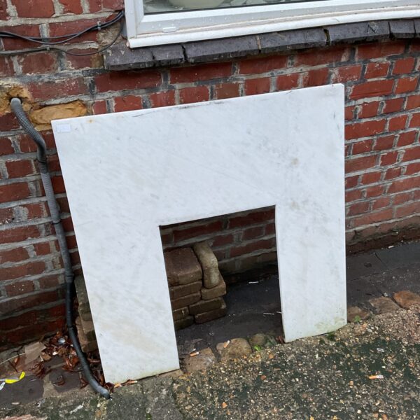 Antique marble fireplace surround, showing classic Victorian design.