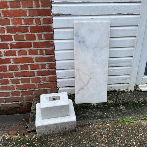 Marble plinth and top set for display and sculpture.