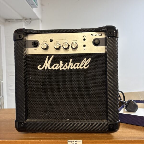 Black Marshall MG10CF guitar amplifier for practice and small gigs.