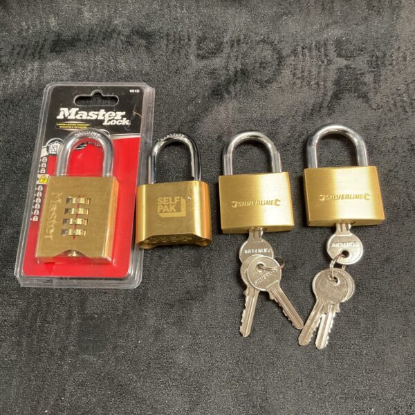 Lot of four new Master Lock combination padlocks in original packaging.