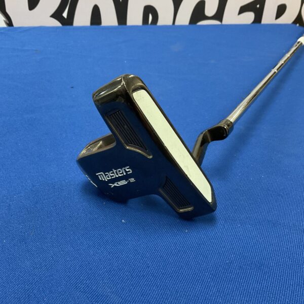 Black Masters XS-2 golf putter on blue background.