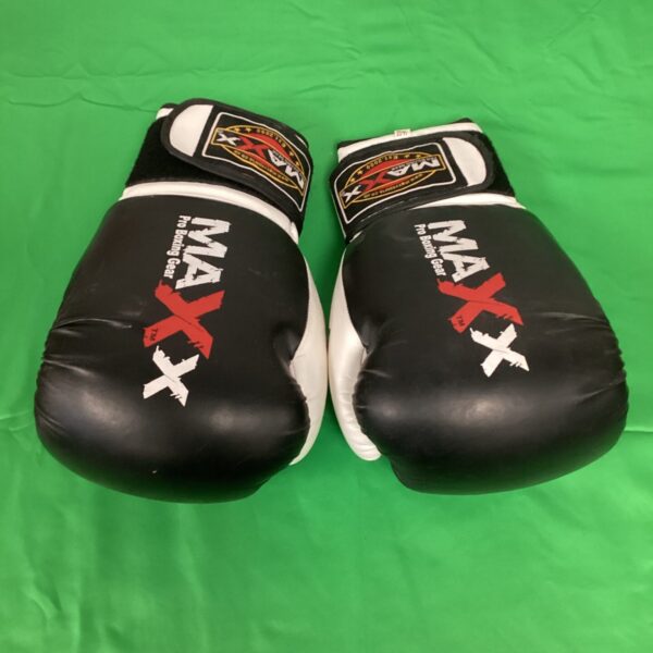 Pair of used Maxx pro boxing gloves for training.