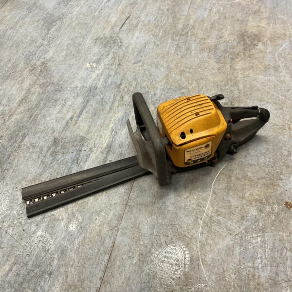 Vintage McCulloch petrol hedge cutter for garden maintenance.
