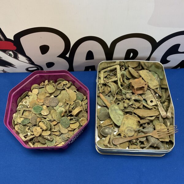 Metal detecting finds lot with coins and buckles.