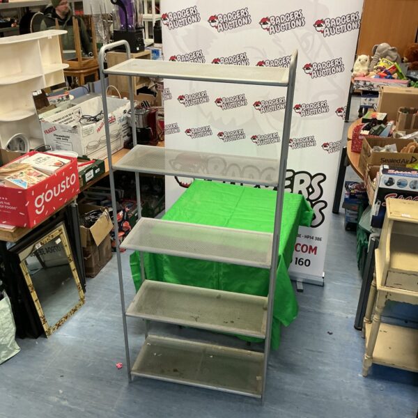 Silver metal storage rack with four tiers for organization.