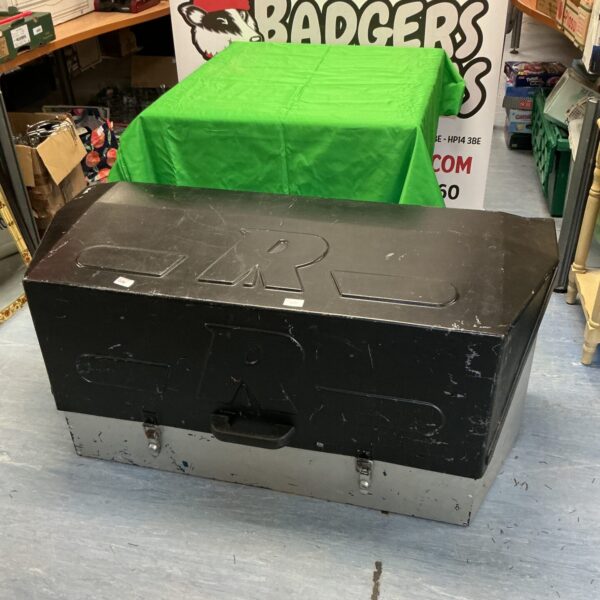Vintage metal tool chest with locking mechanism for secure storage.