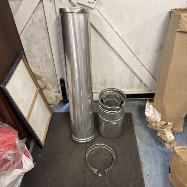 Metaloterm chimney flue pipe and connector in a workshop setting.
