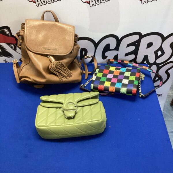 Ladies handbag lot featuring Michael Kors rucksack and Steve Madden bag.