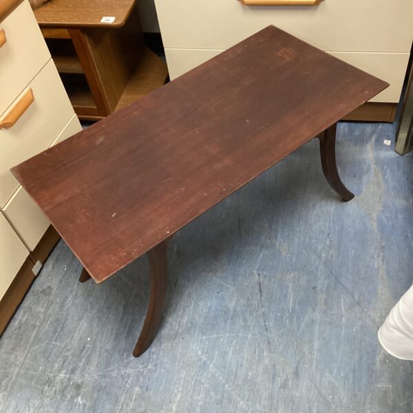 Vintage mid-century modern coffee table with curved legs.