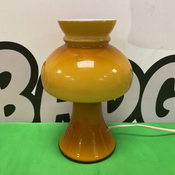 Vibrant orange mid-century mushroom table lamp for retro decor.