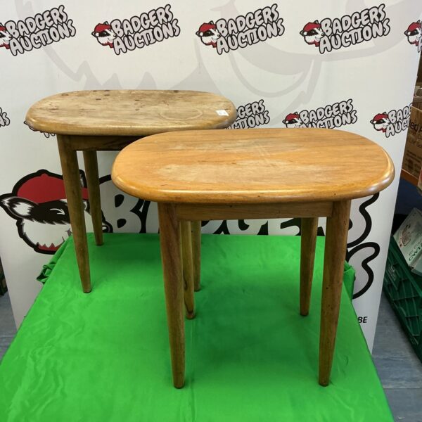 Pair of vintage mid-century oak tables with curved tops.
