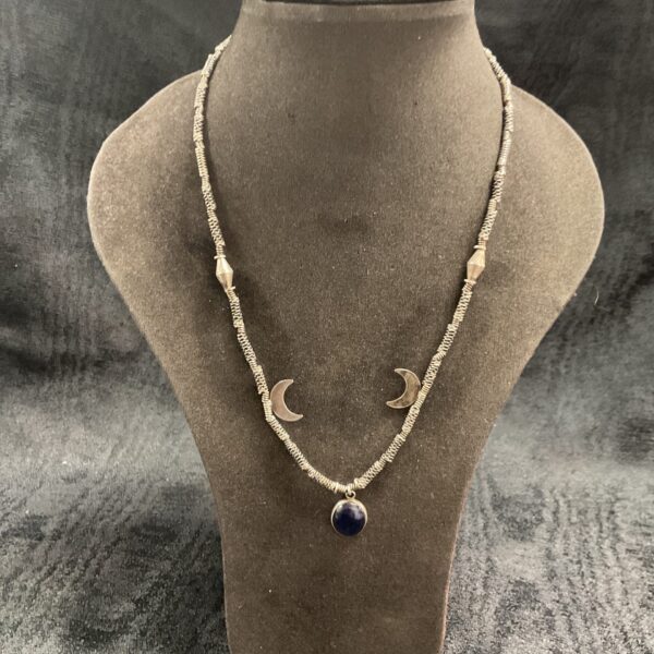 Vintage Middle Eastern silver necklace with detailed pendant.