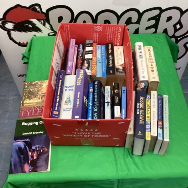 Mixed book lot featuring paperback novels and vintage books.