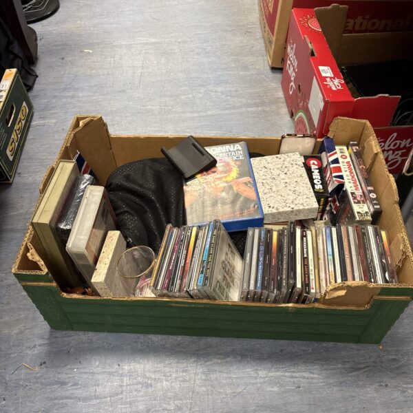Mixed CD and VHS lot in a wooden box.