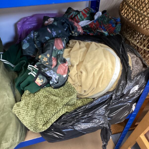 Mixed clothing lot bundle with various garments and colours.