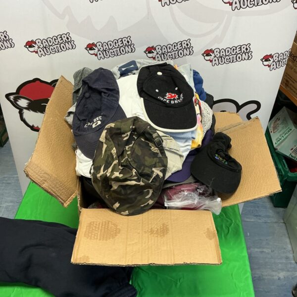 Mixed clothing lot with caps and assorted garments.